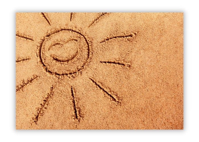 smiling sunshine drawn in sand